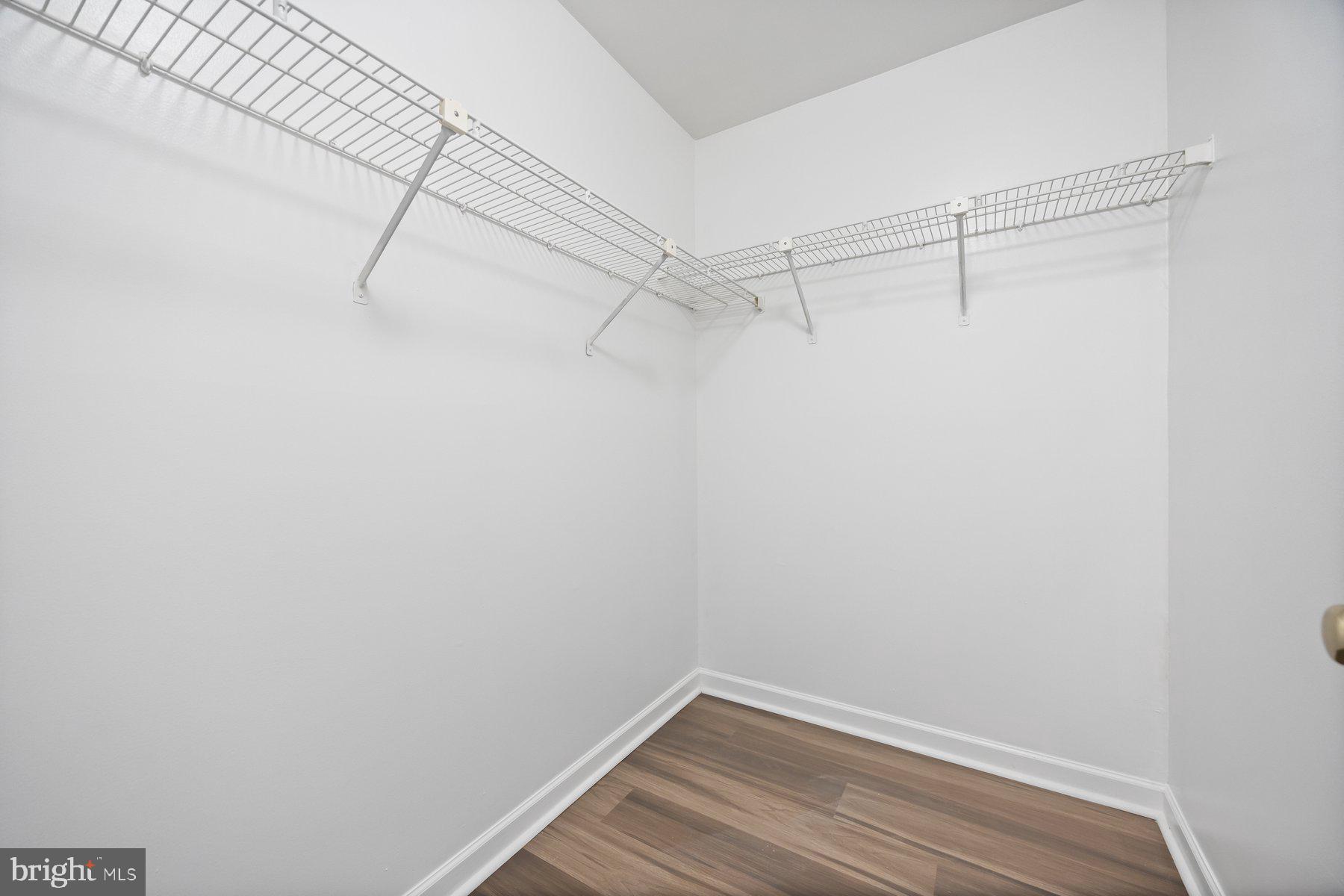 8393 Montgomery Run Road, Unit H Ellicott City, MD 21043 - Photo 25 of 30 a view of a room with racks on the wall