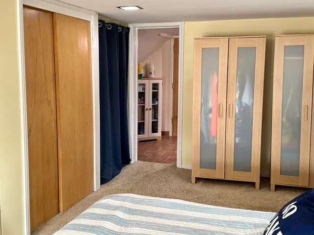 a view of a bedroom from a hallway