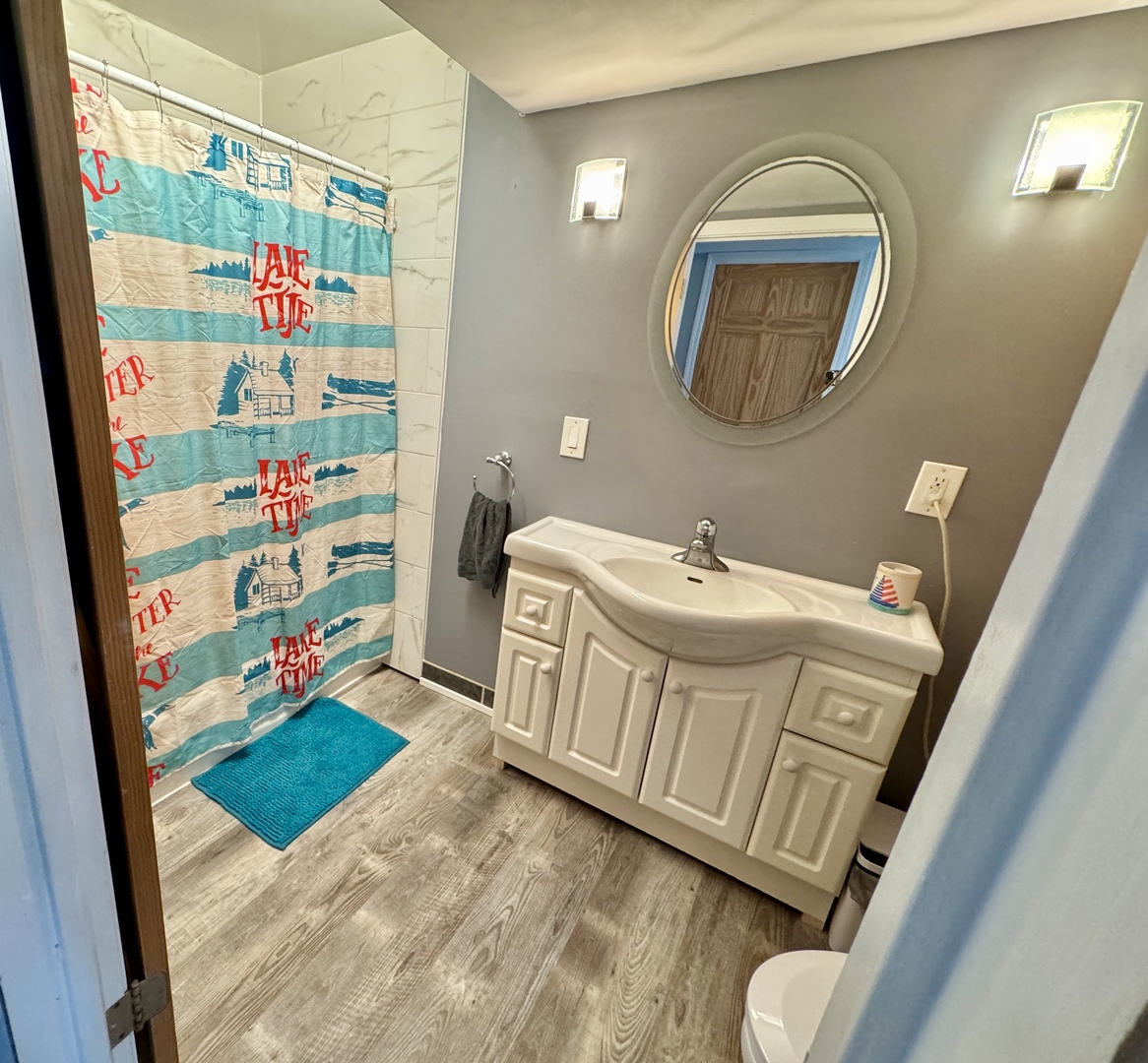 4400 Riverside Drive Crystal Lake, IL 60014 - Photo 16 of 22 a bathroom with a sink mirror and vanity