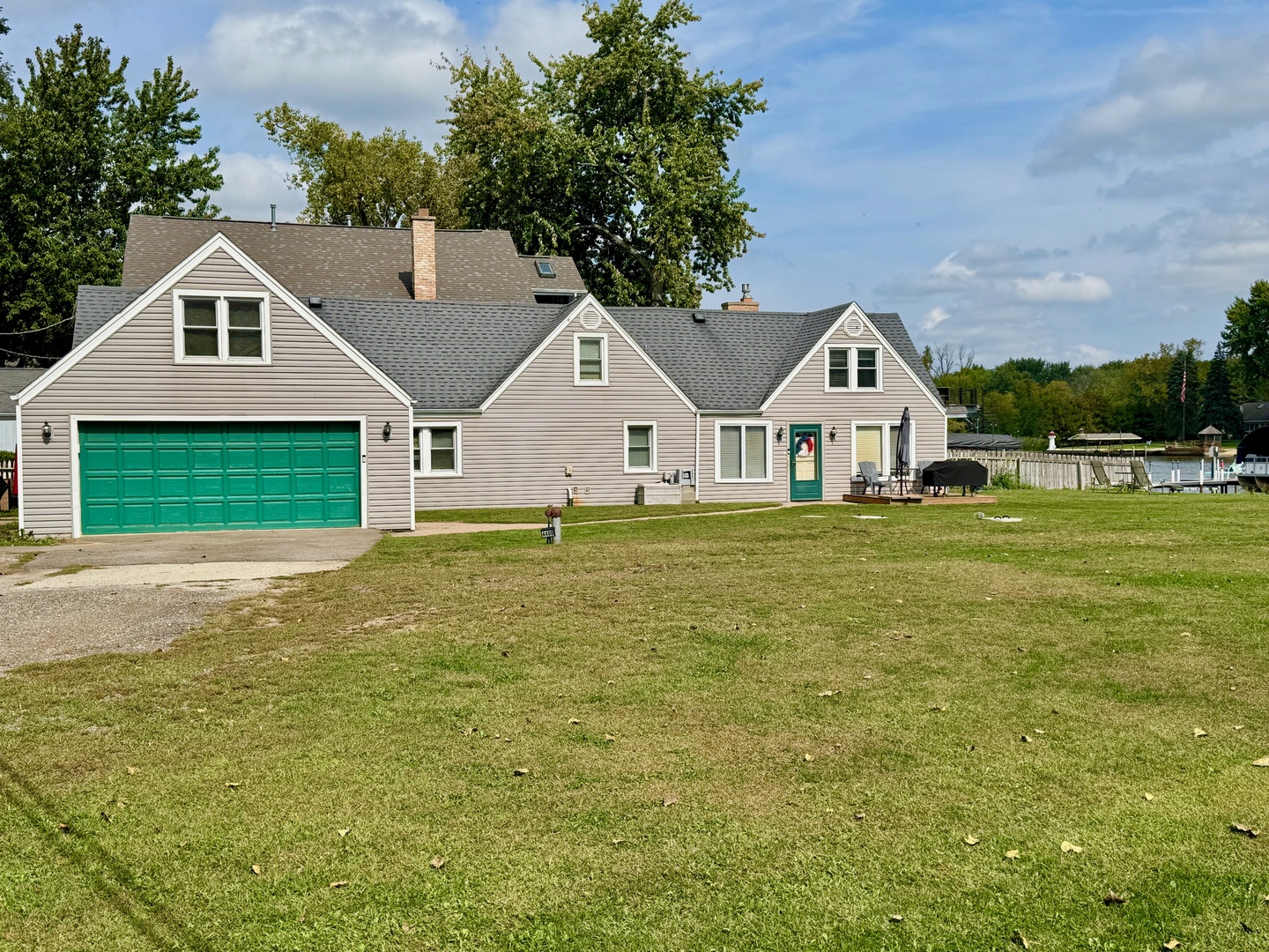 4400 Riverside Drive Crystal Lake, IL 60014 - Photo 2 of 22 a front view of a house with a garden and yard