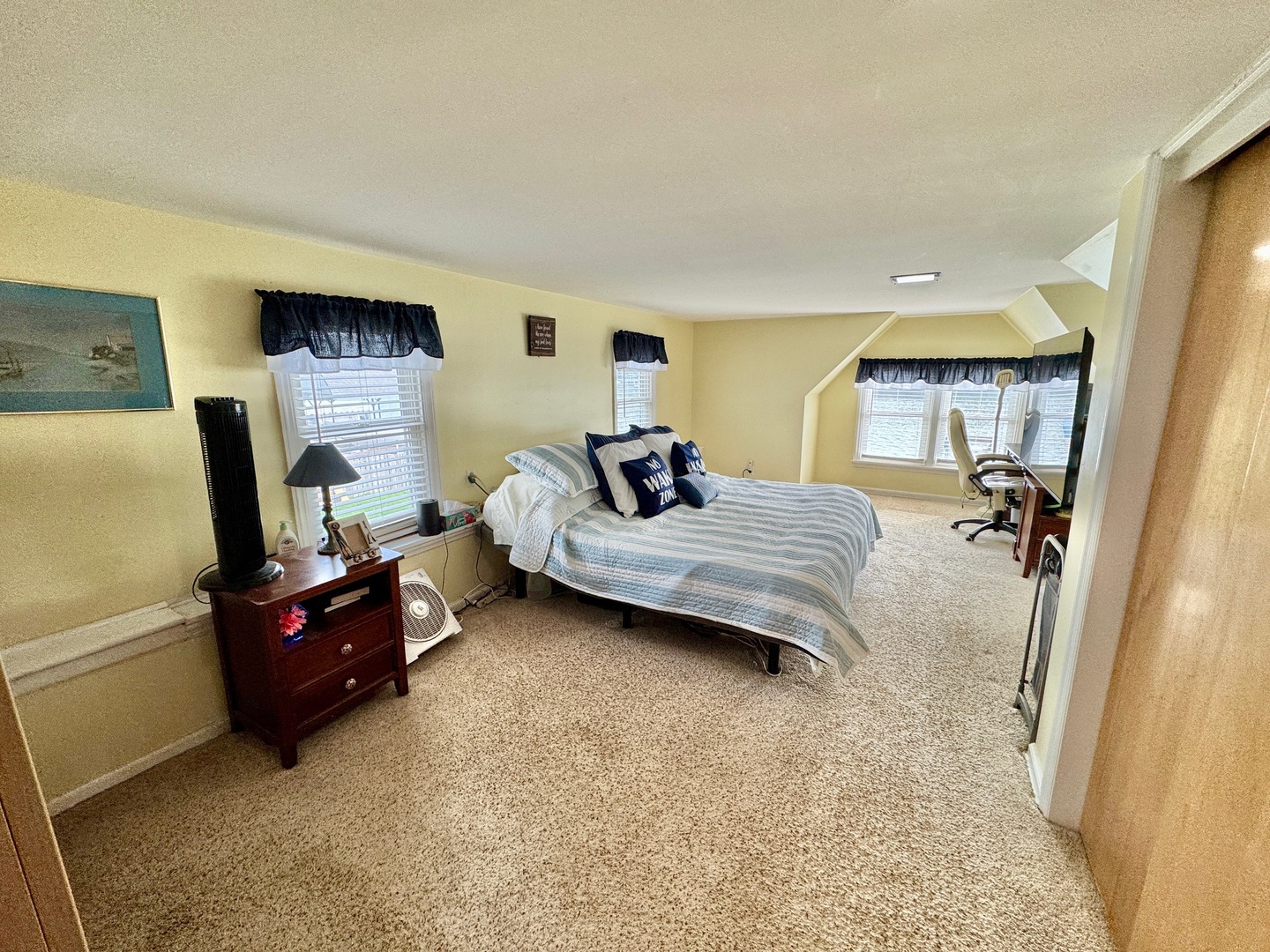 4400 Riverside Drive Crystal Lake, IL 60014 - Photo 10 of 22 a bedroom with a bed and large windows
