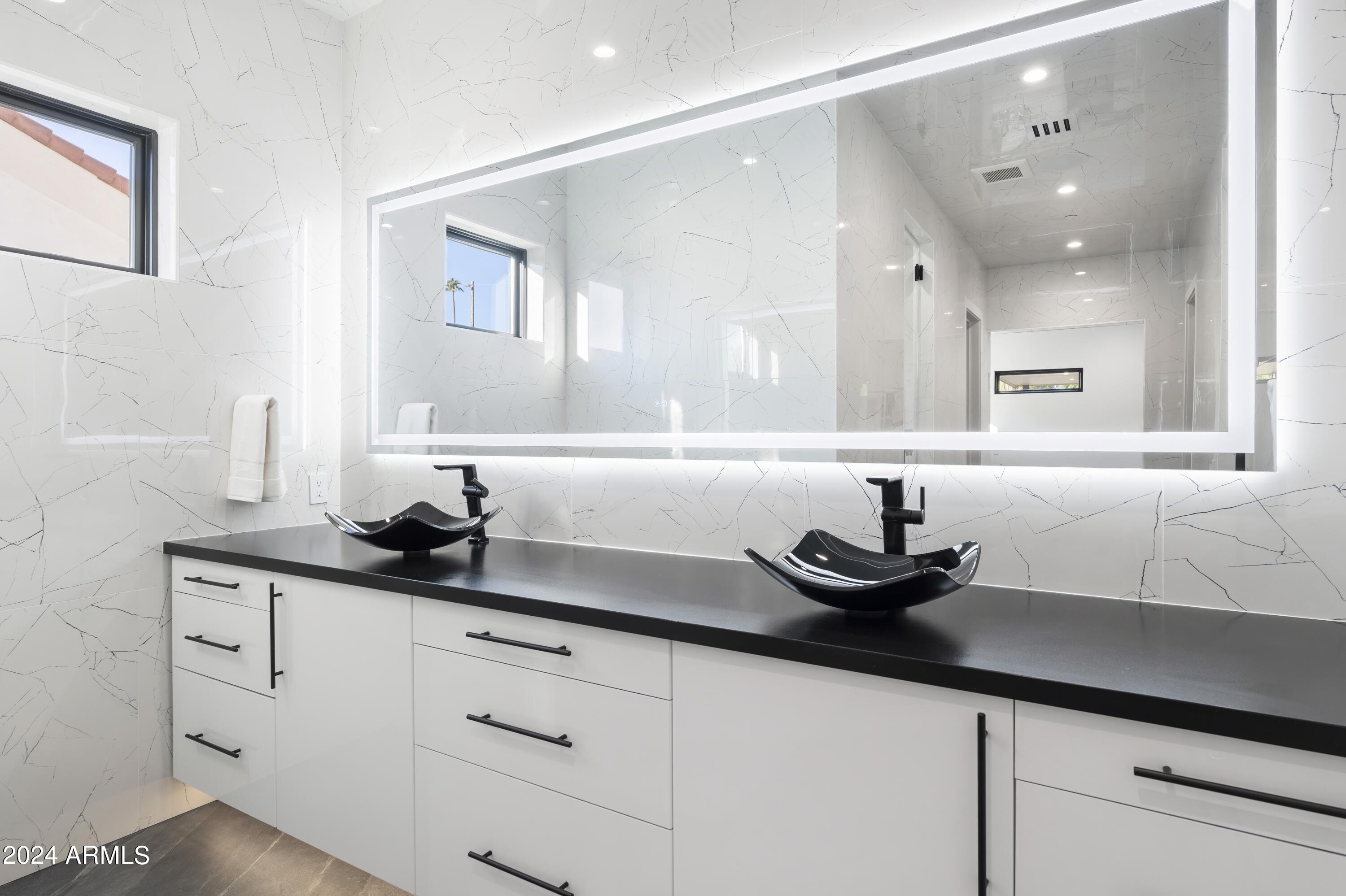8037 North 7th Avenue Phoenix, AZ 85021 - Photo 21 of 40 a kitchen with a sink and cabinets