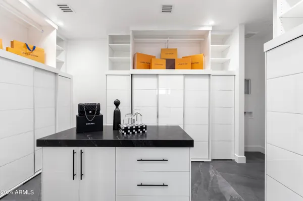 a kitchen with stainless steel appliances granite countertop a refrigerator and a stove