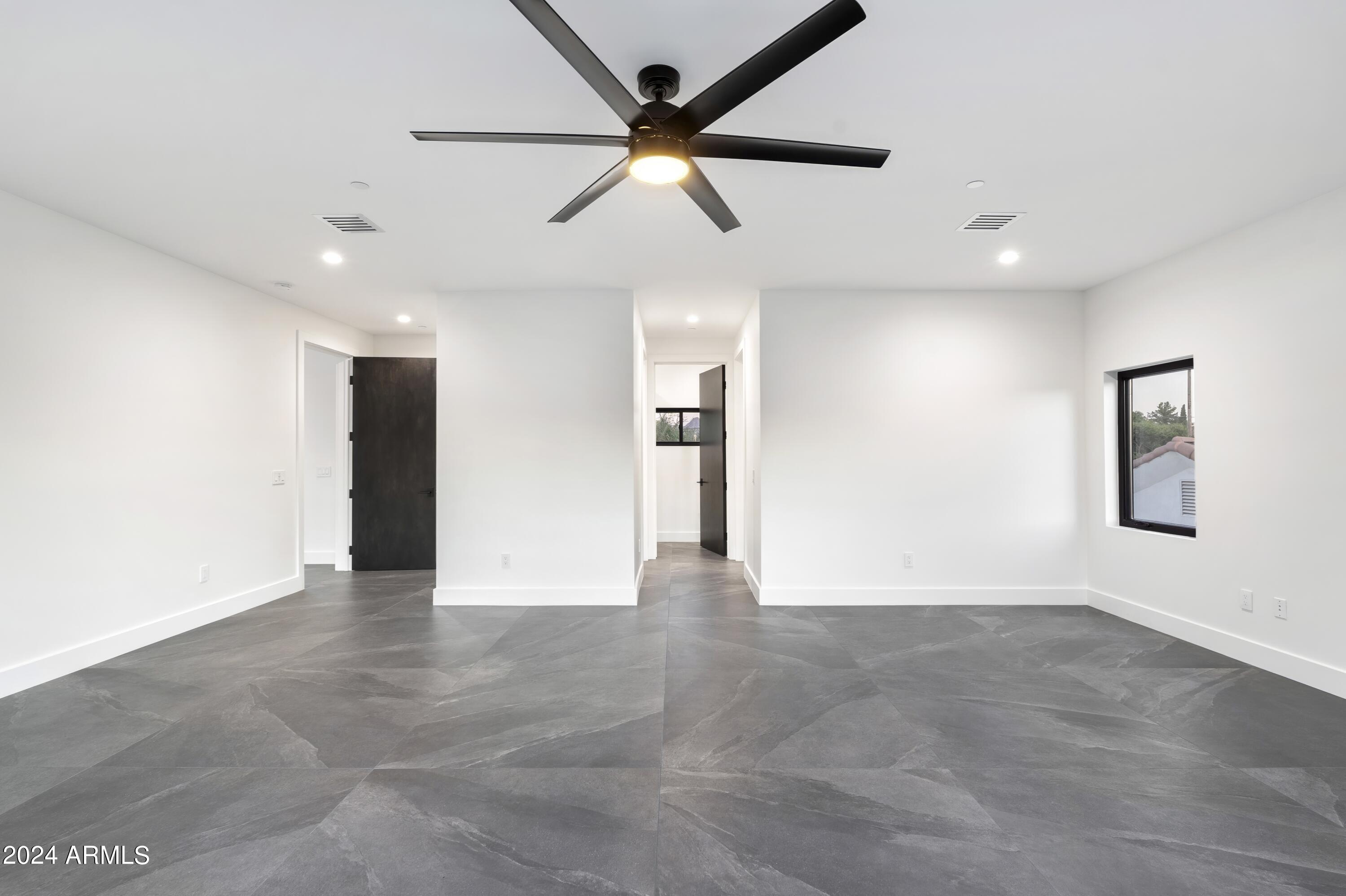 8037 North 7th Avenue Phoenix, AZ 85021 - Photo 31 of 40 a view of an empty room with a window