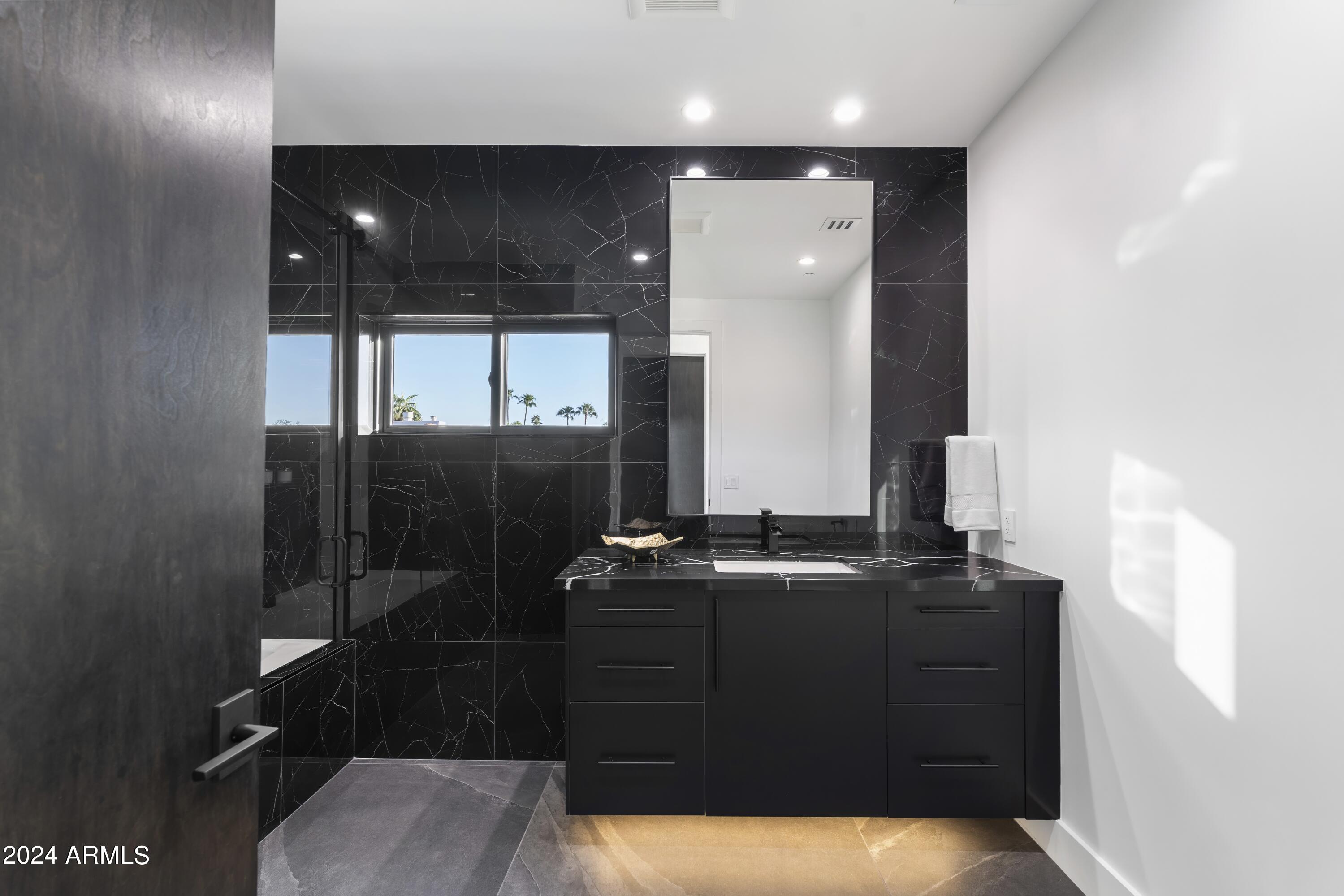 8037 North 7th Avenue Phoenix, AZ 85021 - Photo 32 of 40 a bathroom with a sink and a mirror