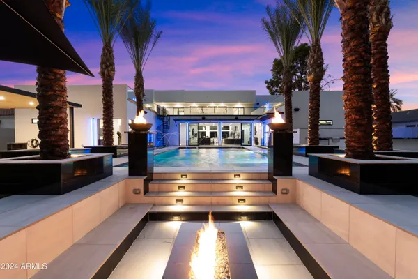 a view of swimming pool with a table and chairs