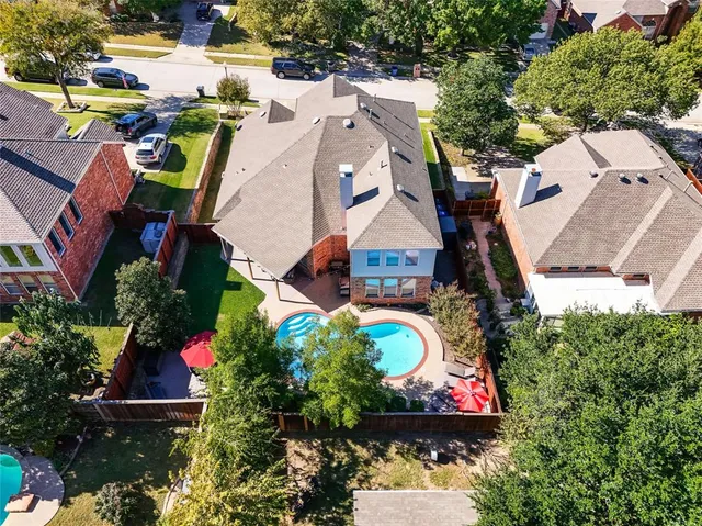 an aerial view of houses with outdoor space