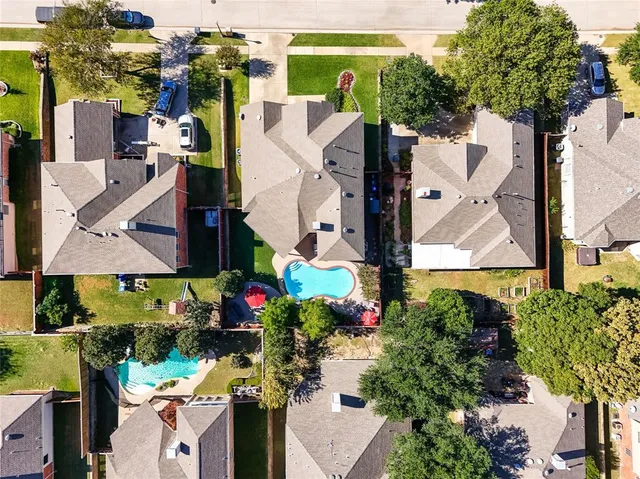 an aerial view of multiple houses with outdoor space