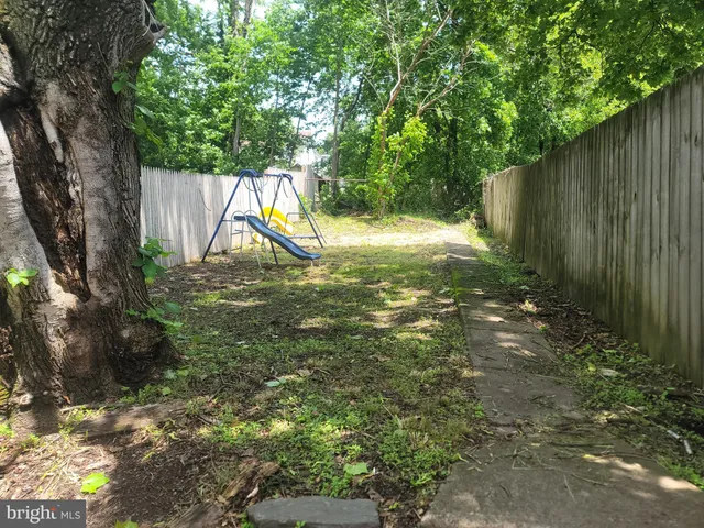 a view of a yard with a tree