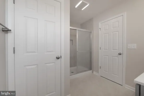 a bathroom with 2 sink and a mirror