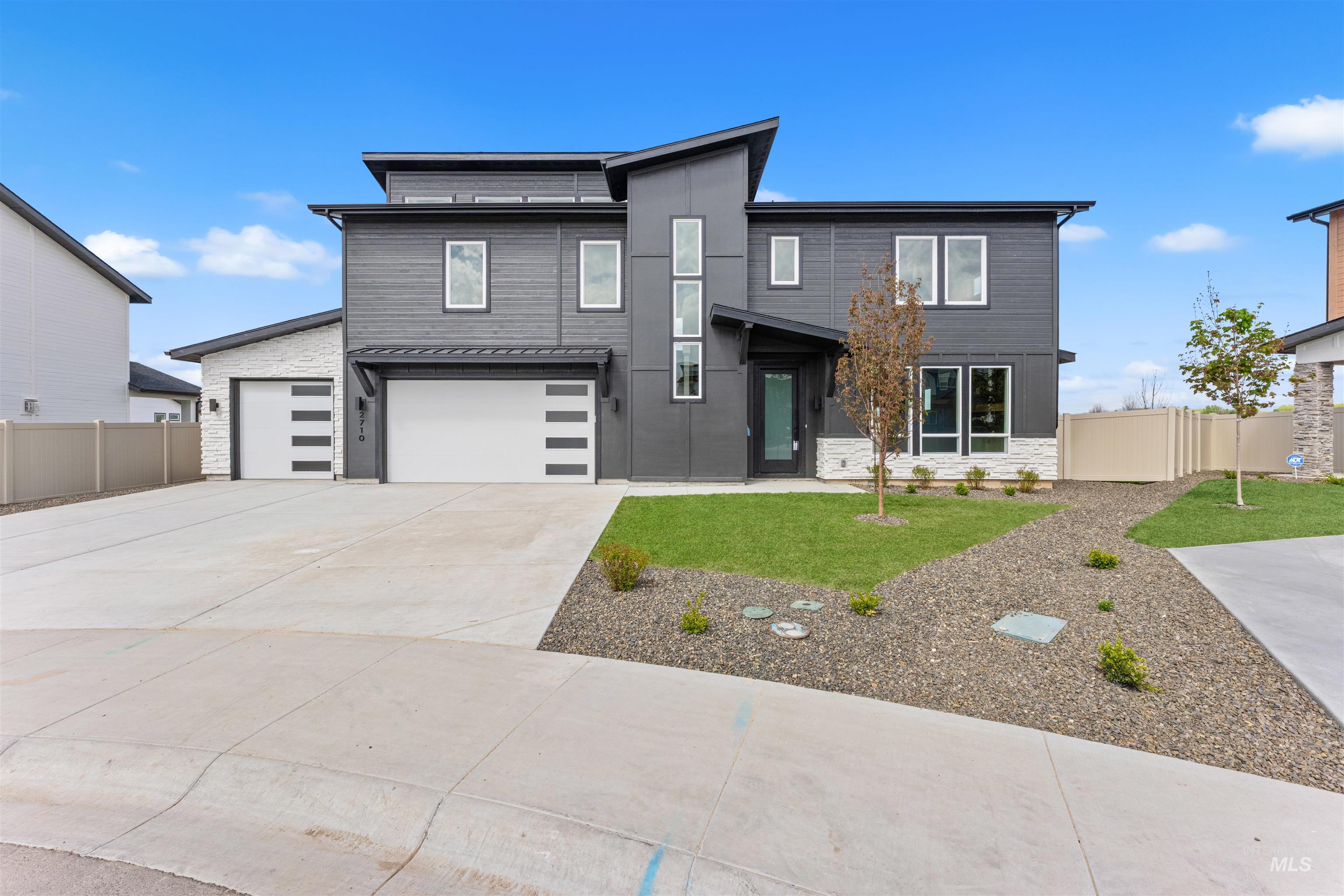 Modern architectural exterior featuring mixed materials and a multi-level design