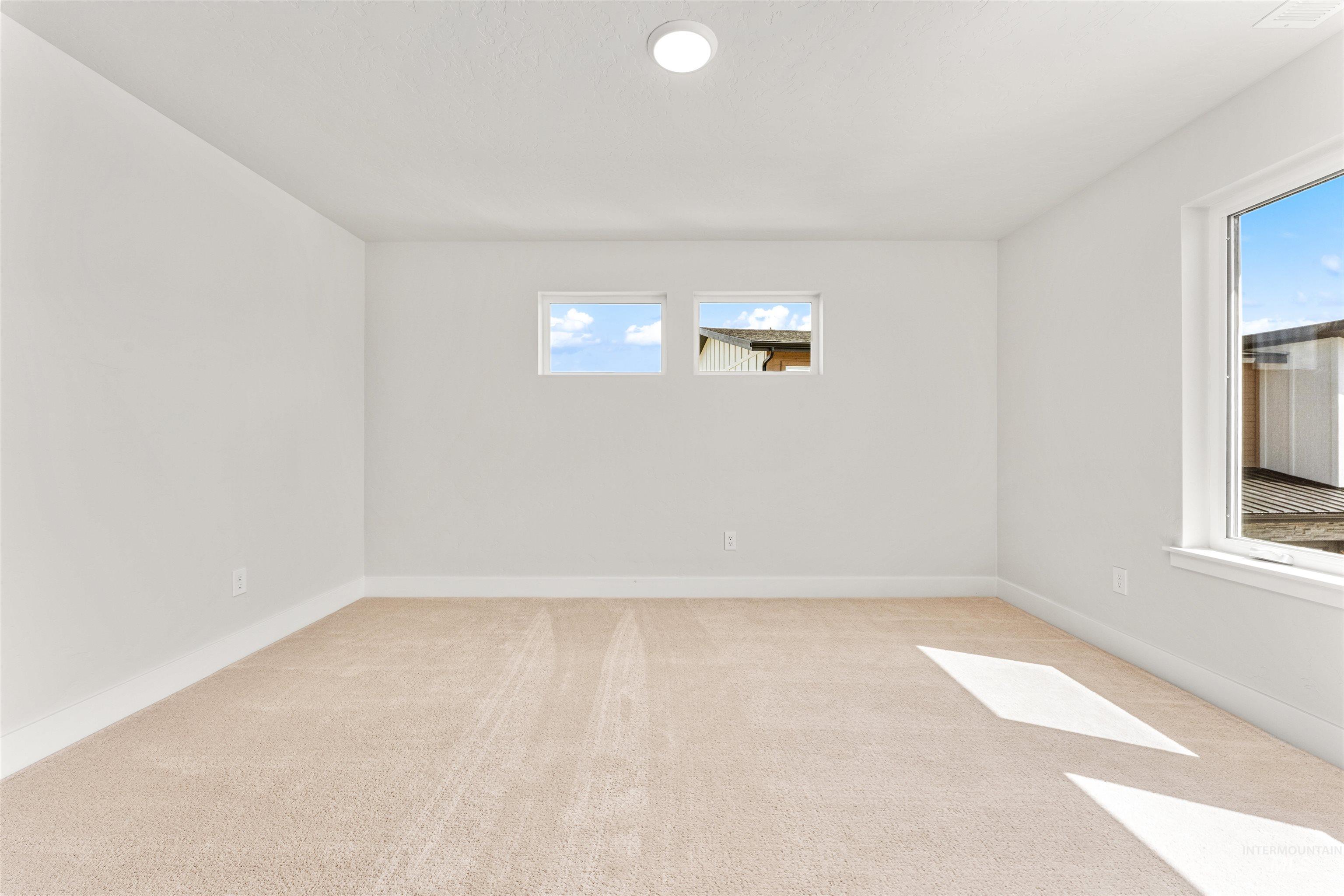 2709 West Gidran Meridian, ID 83642 - Photo 31 of 43 Spacious room featuring neutral carpeting and white baseboards