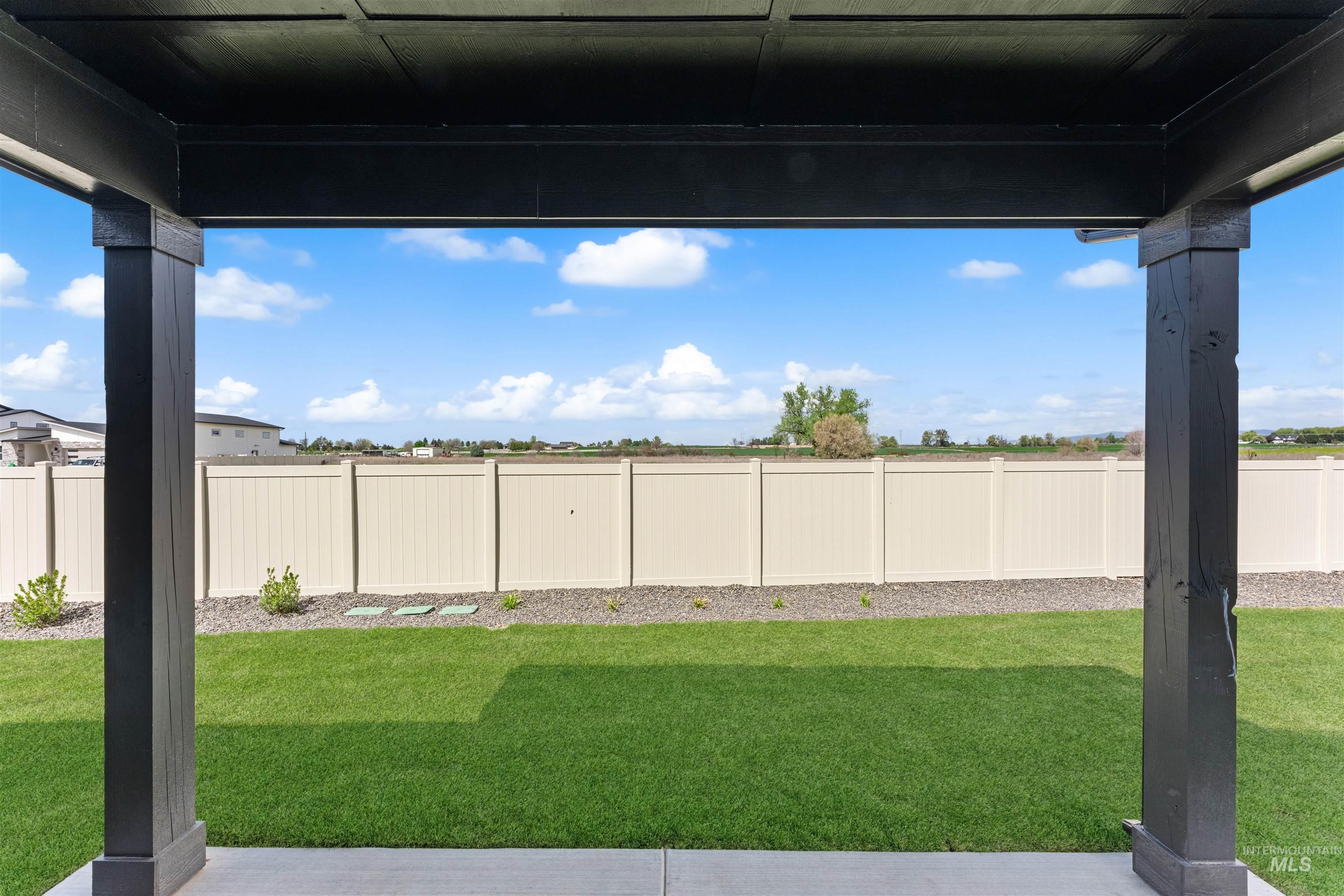 2709 West Gidran Meridian, ID 83642 - Photo 36 of 43 Covered patio featuring robust black architectural beams
