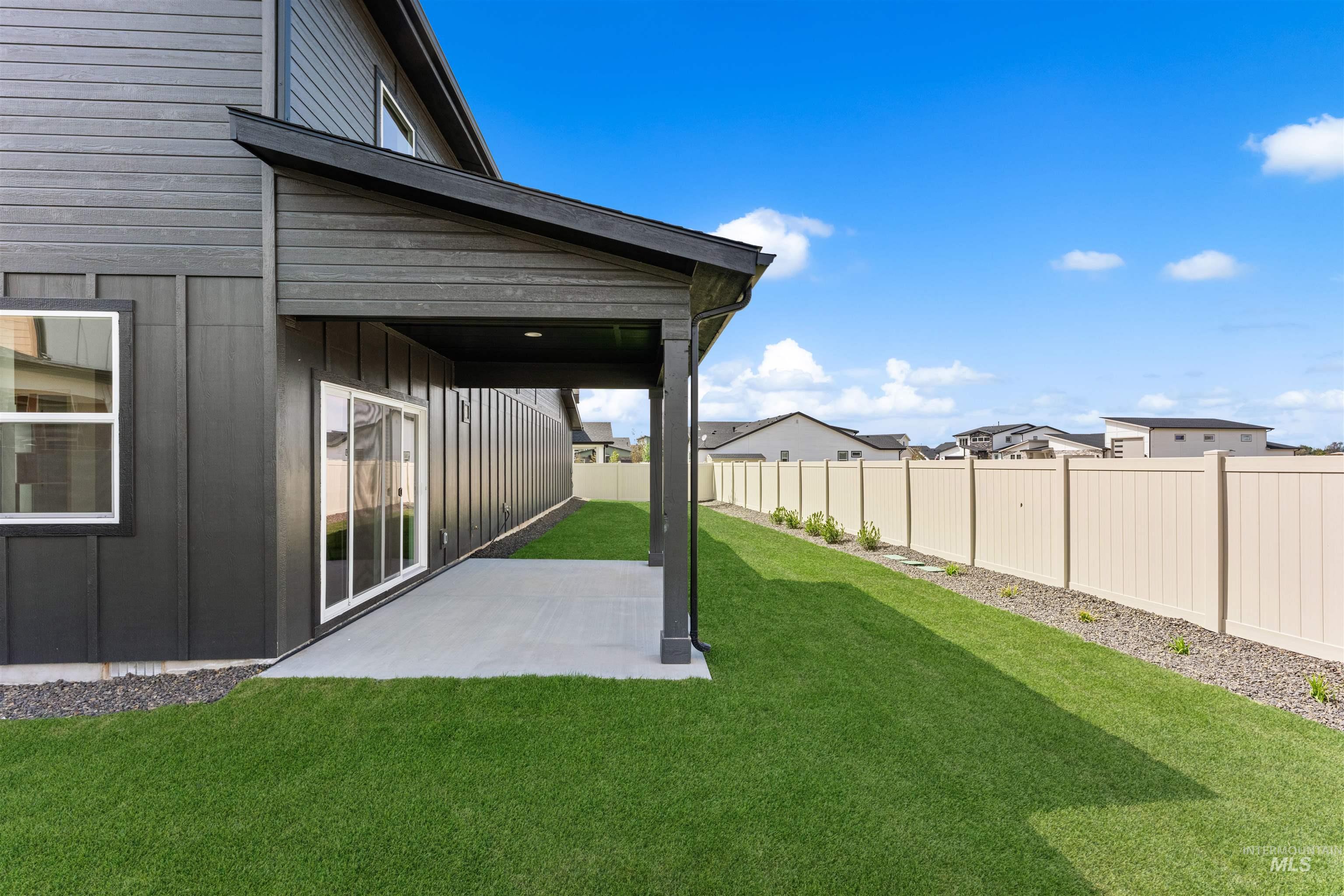 2709 West Gidran Meridian, ID 83642 - Photo 41 of 43 Covered patio with concrete slab and dark gray siding