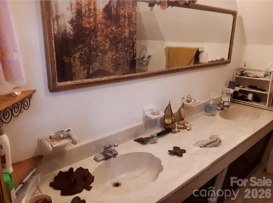 705 Dr Howell Road Spruce Pine, NC 28777 - Photo 3 of 11 a bathroom with a sink and a mirror