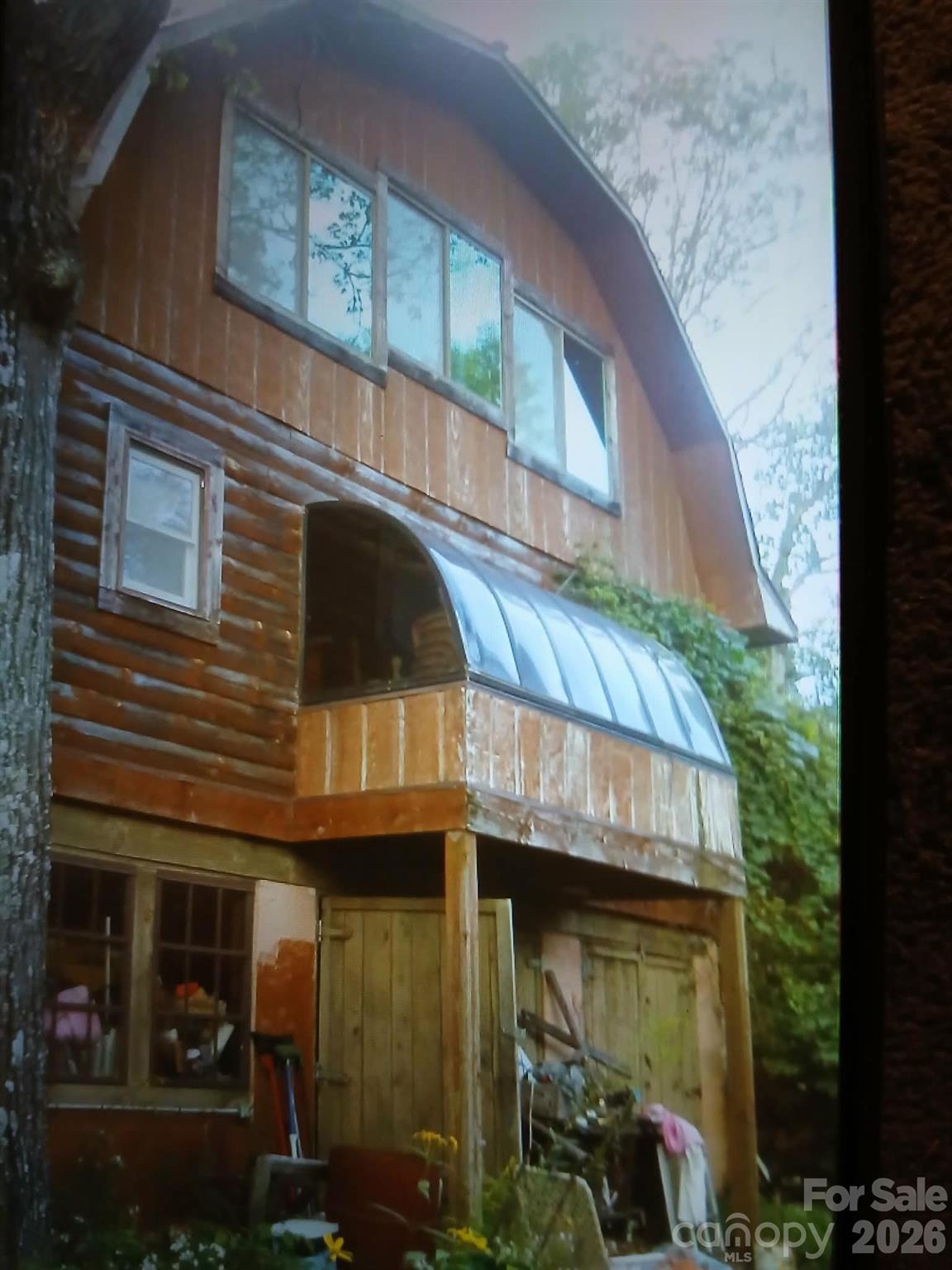 705 Dr Howell Road Spruce Pine, NC 28777 - Photo 6 of 11 a view of a building with a door and a balcony