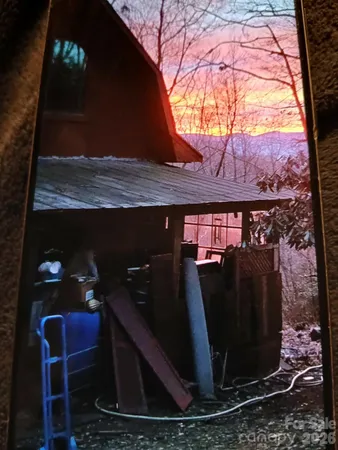 a view of a backyard of the house