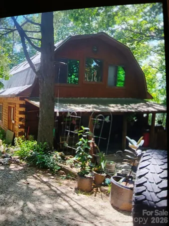 a view of a chair and table in backyard