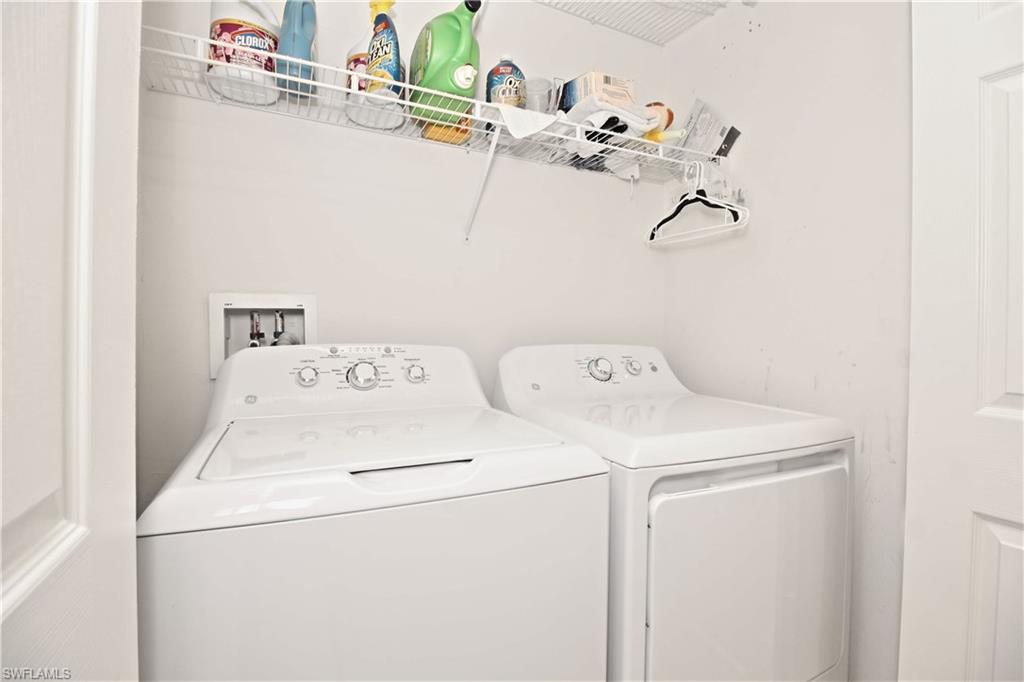 422 Valerie Way, Unit 202 Naples, FL 34104 - Photo 11 of 19 a utility room with dryer and washer