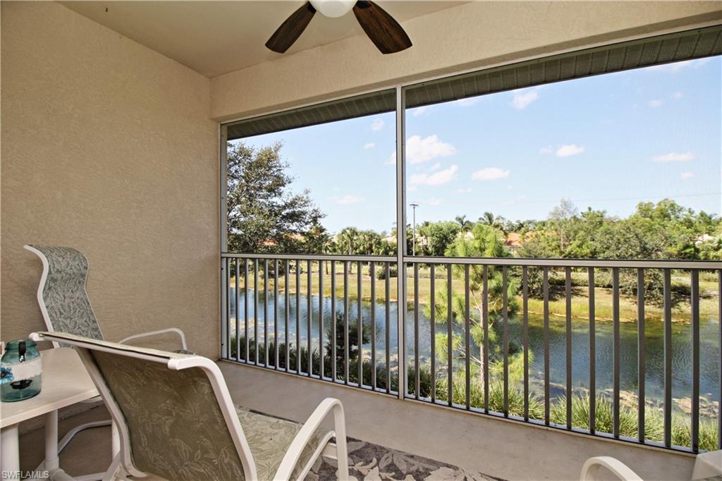 422 Valerie Way, Unit 202 Naples, FL 34104 - Photo 13 of 19 a balcony with wooden floor