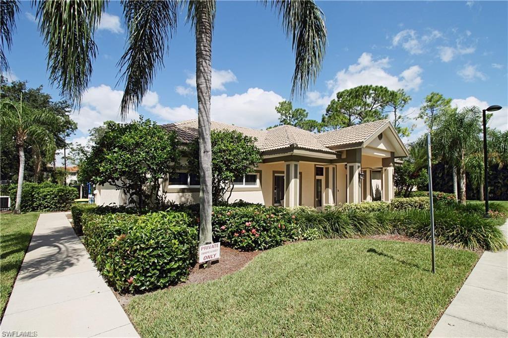 422 Valerie Way, Unit 202 Naples, FL 34104 - Photo 18 of 19 a view of a house with a garden
