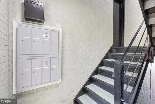 a view of entryway with wooden floor and stairs