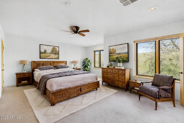 a bedroom with a bed and a couch