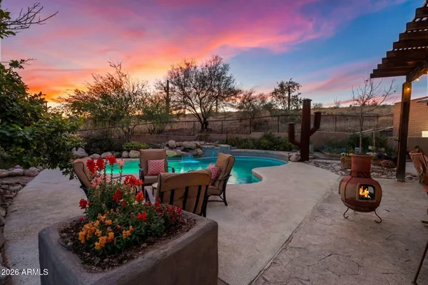 a view of a chairs and tables in the patio