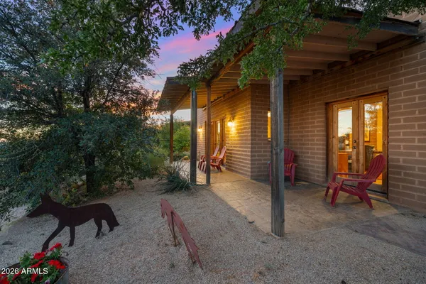 a view of a room with a patio and backyard