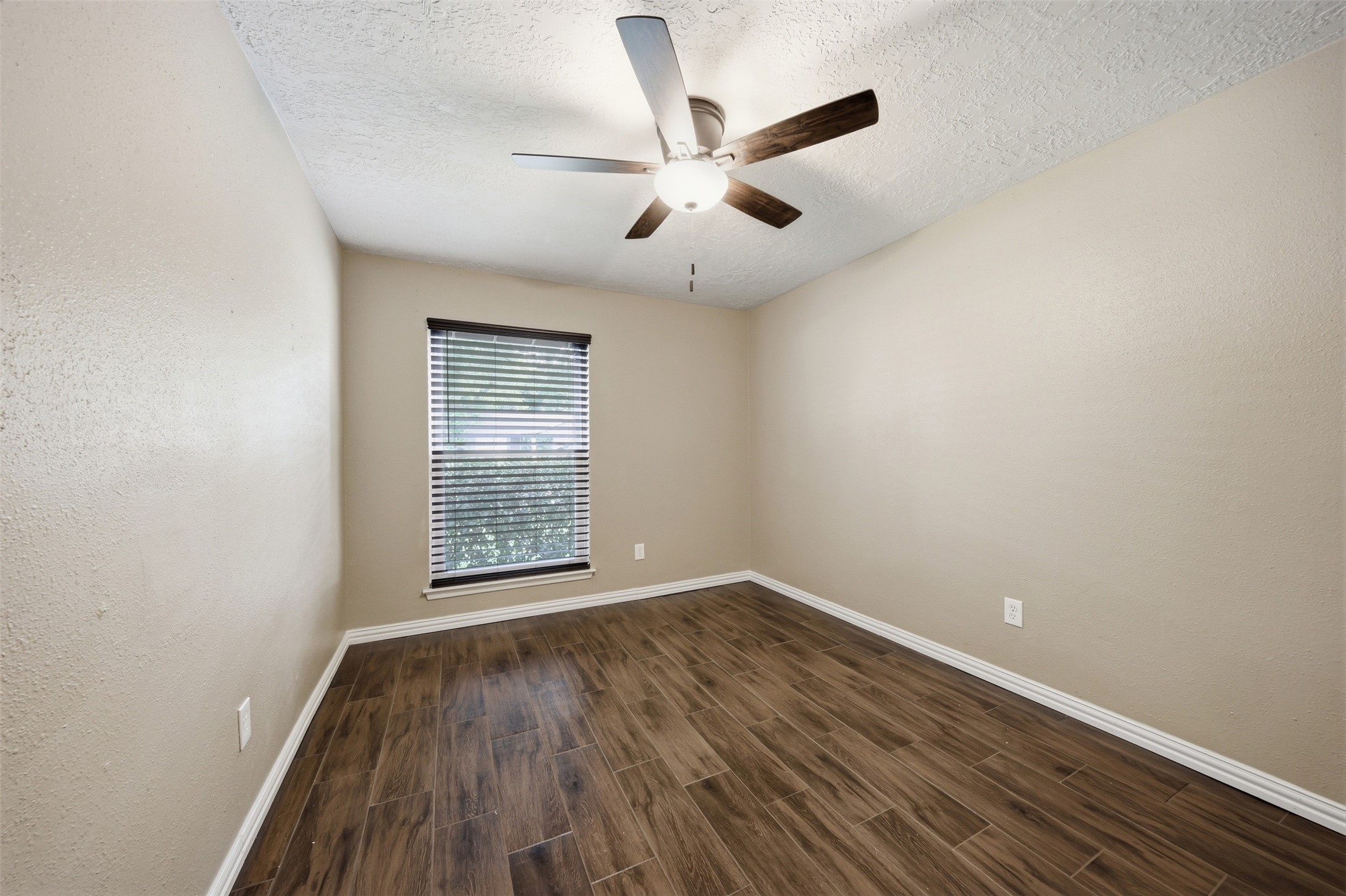 9418 Kilrenny Drive Spring, TX 77379 - Photo 32 of 47 wooden floor in an empty room with a window