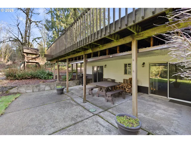 a view of backyard with a deck