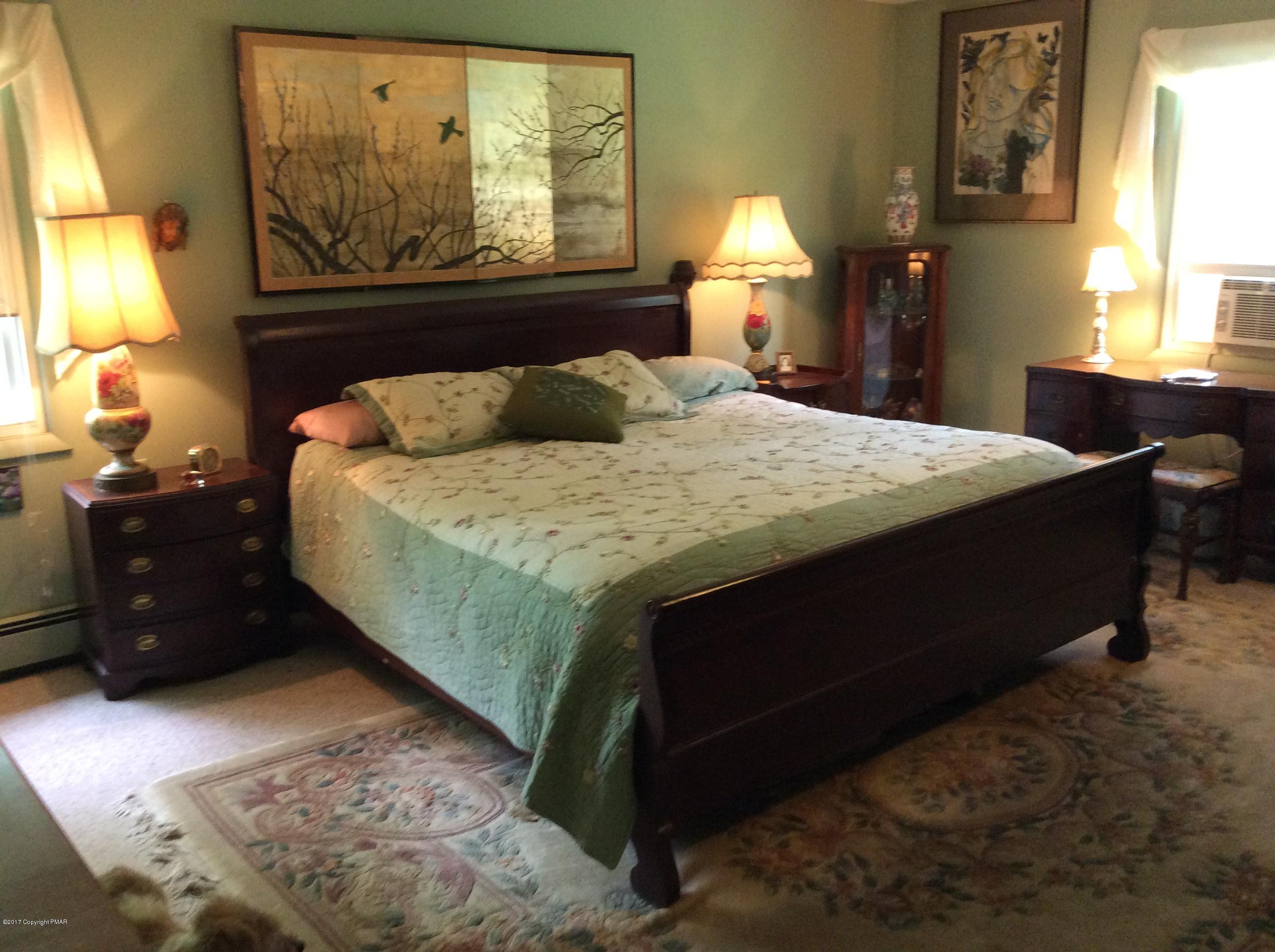 319 Henry's Crossing Road Cresco, PA 18326 - Photo 11 of 29 a bedroom with a bed and window