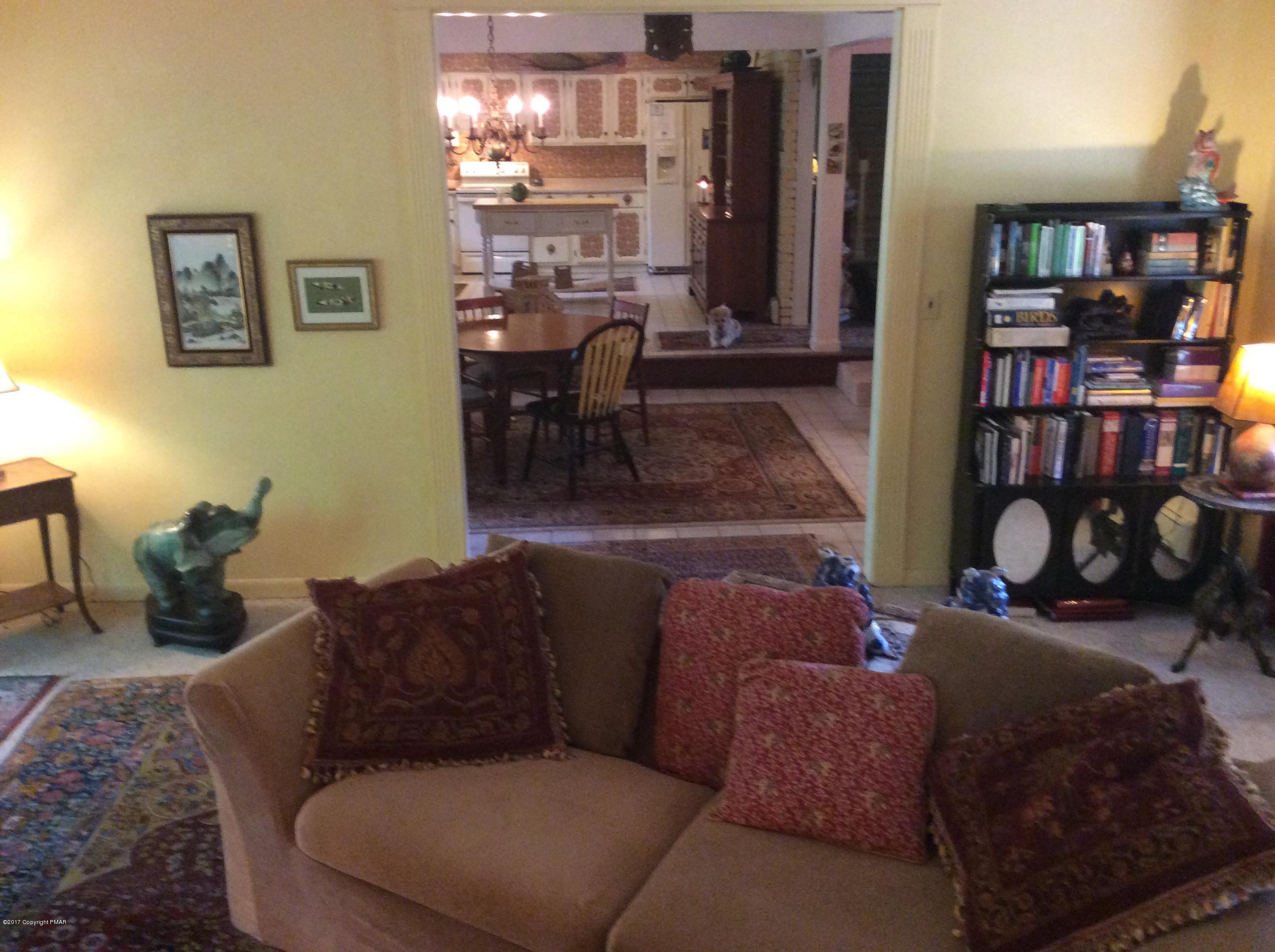 319 Henry's Crossing Road Cresco, PA 18326 - Photo 10 of 29 a living room with furniture and a piano