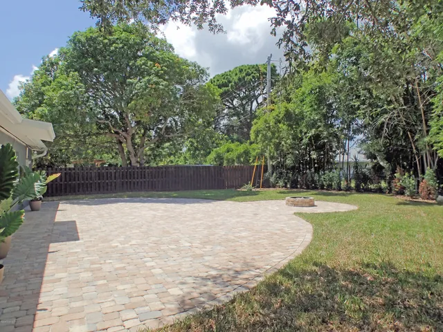 a view of a swimming pool with a yard
