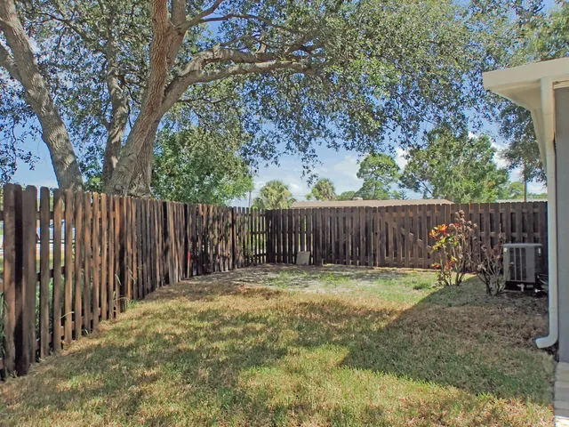 a view of outdoor space with wooden fence