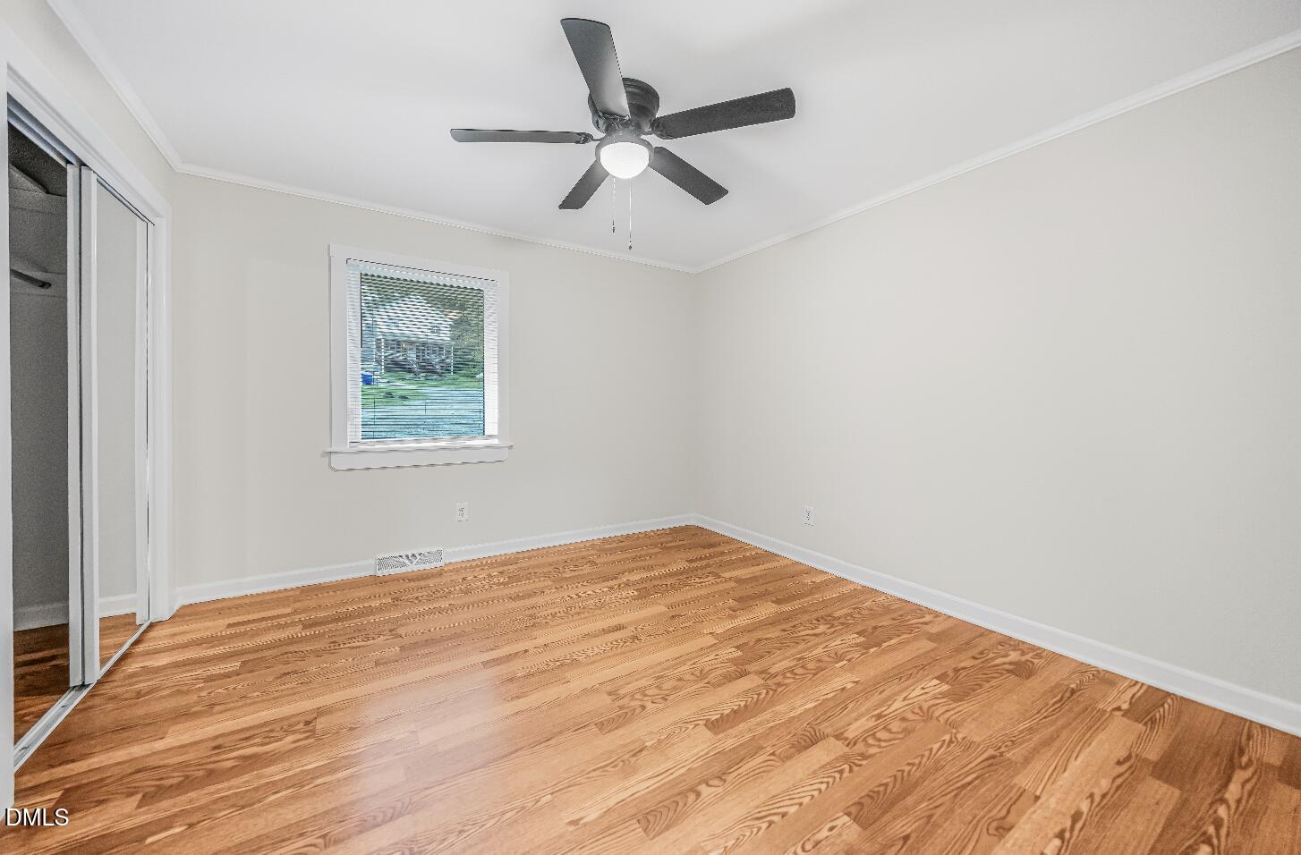201 Howell Street, Unit 300A Chapel Hill, NC 27514 - Photo 12 of 15 a view of empty room with wooden floor and ceiling fan