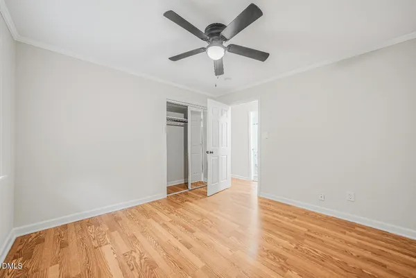 a view of a room with a ceiling fan