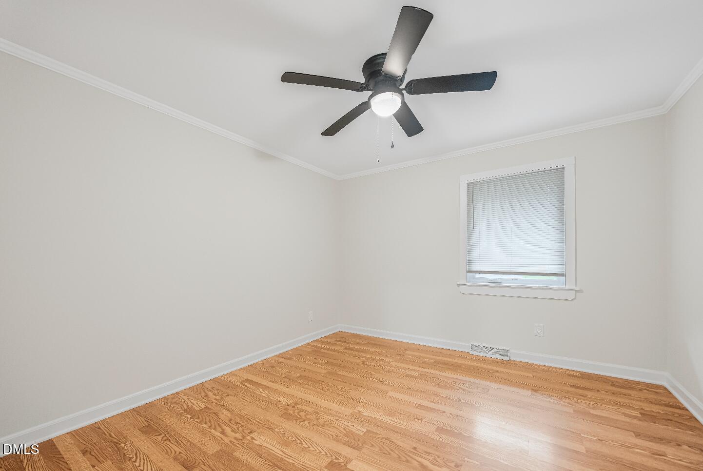 201 Howell Street, Unit 300A Chapel Hill, NC 27514 - Photo 9 of 15 a view of a big room with wooden floor and a ceiling fan