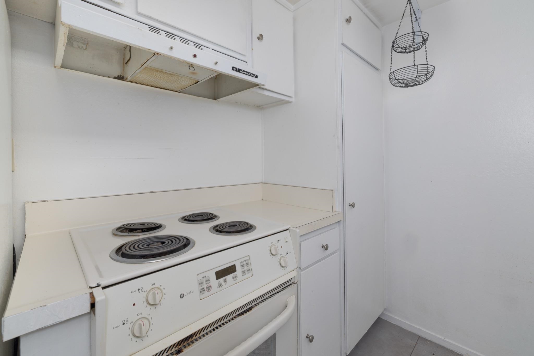 25 Lee Road, Unit 103 Mammoth Lakes, CA 93546 - Photo 14 of 29 a kitchen with cabinets and steel appliances