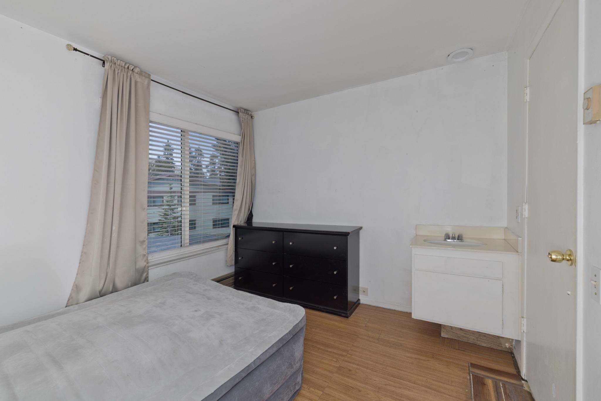25 Lee Road, Unit 103 Mammoth Lakes, CA 93546 - Photo 17 of 29 a room with a bed and a dresser