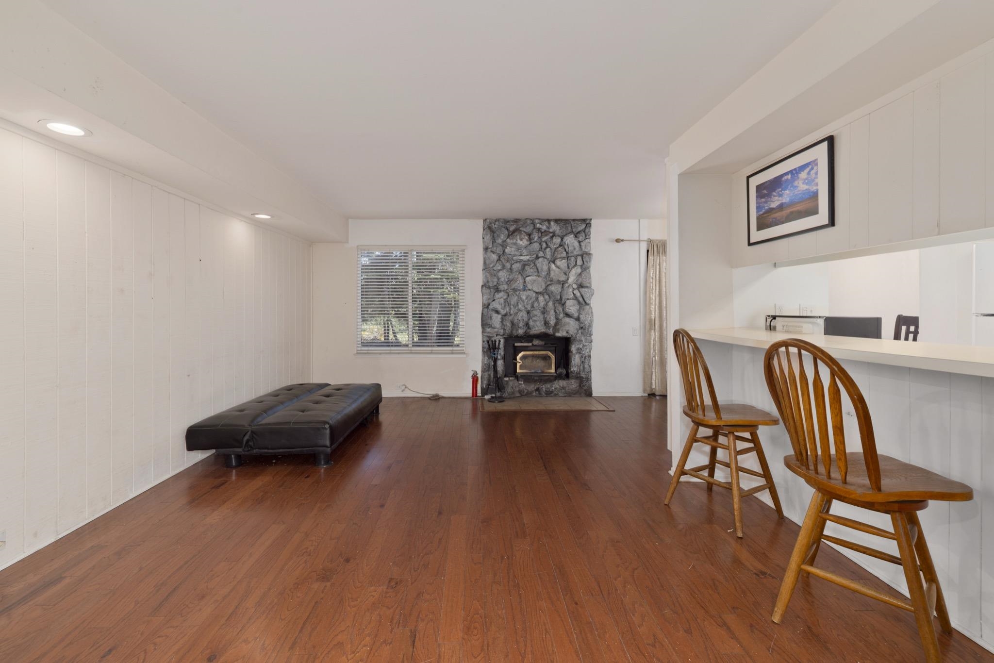 25 Lee Road, Unit 103 Mammoth Lakes, CA 93546 - Photo 9 of 29 a living room with furniture and a fireplace