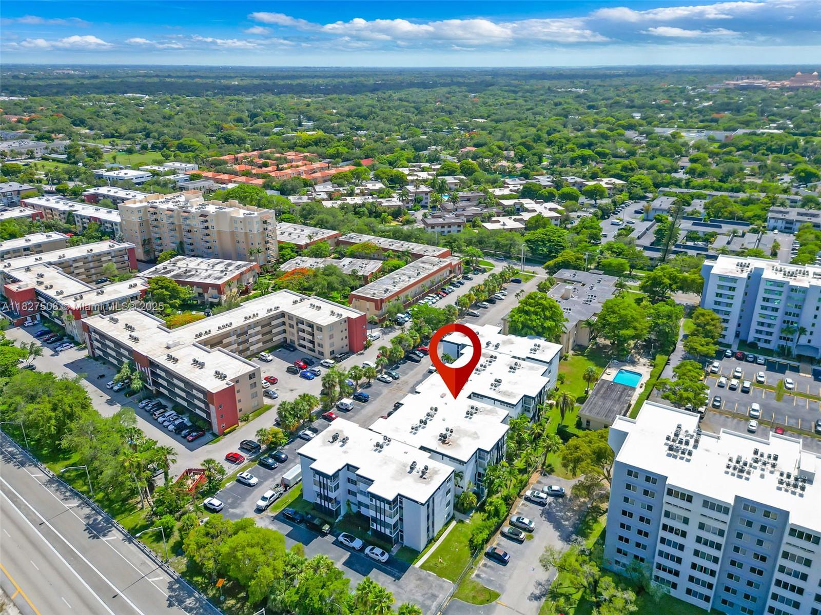 an aerial view of residential houses and outdoor space
