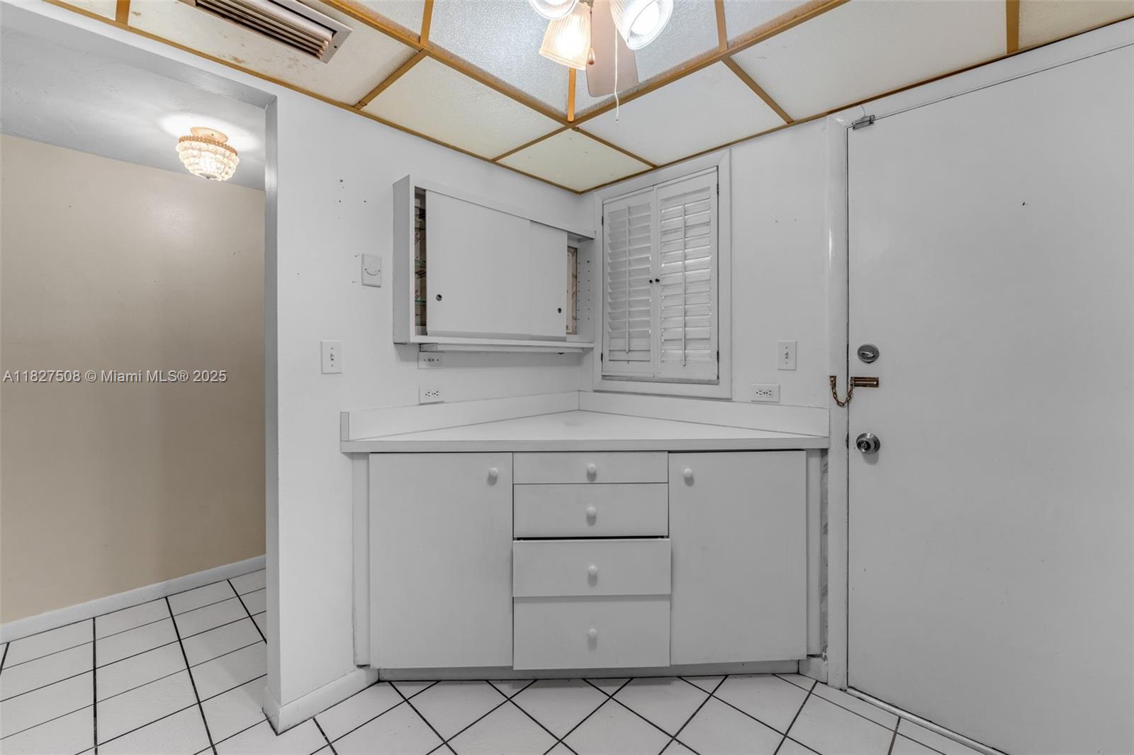 9159 Southwest 77th Avenue, Unit 314 Miami, FL 33156 - Photo 7 of 22 a bathroom with a granite countertop sink and cabinets