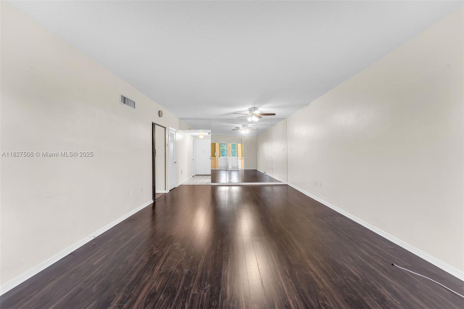 9159 Southwest 77th Avenue, Unit 314 Miami, FL 33156 - Photo 10 of 22 a view of an empty room with wooden floor