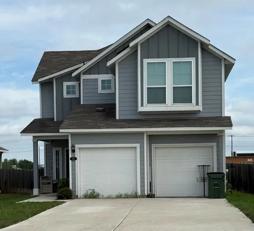 a front view of a house with yard