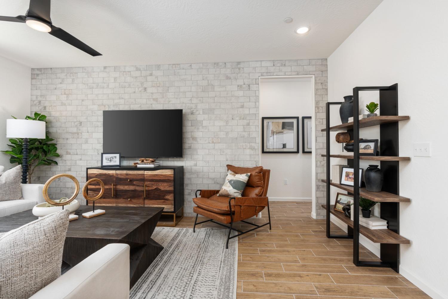 1680 Bloom Avenue Clovis, CA 93619 - Photo 7 of 28 a living room with furniture and a flat screen tv