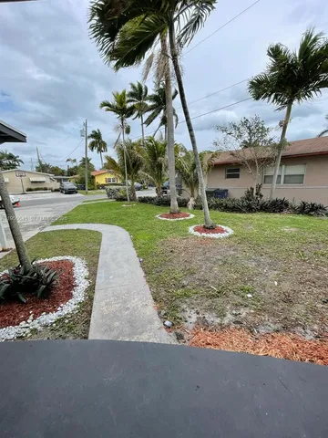 a view of a park with swings and slides