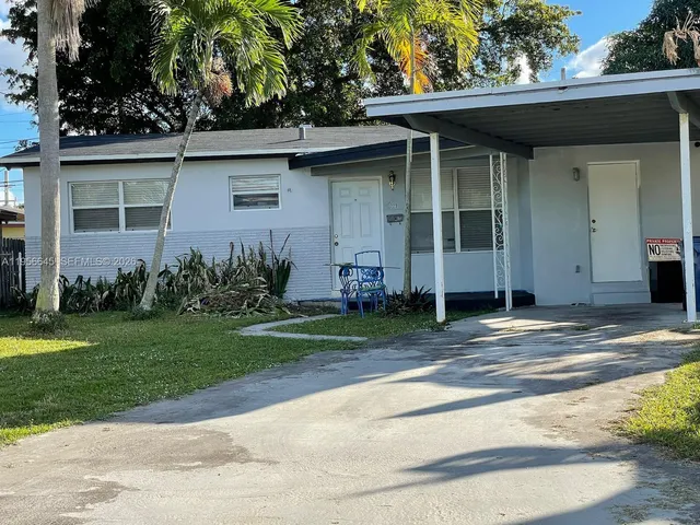 a view of a house with a garden