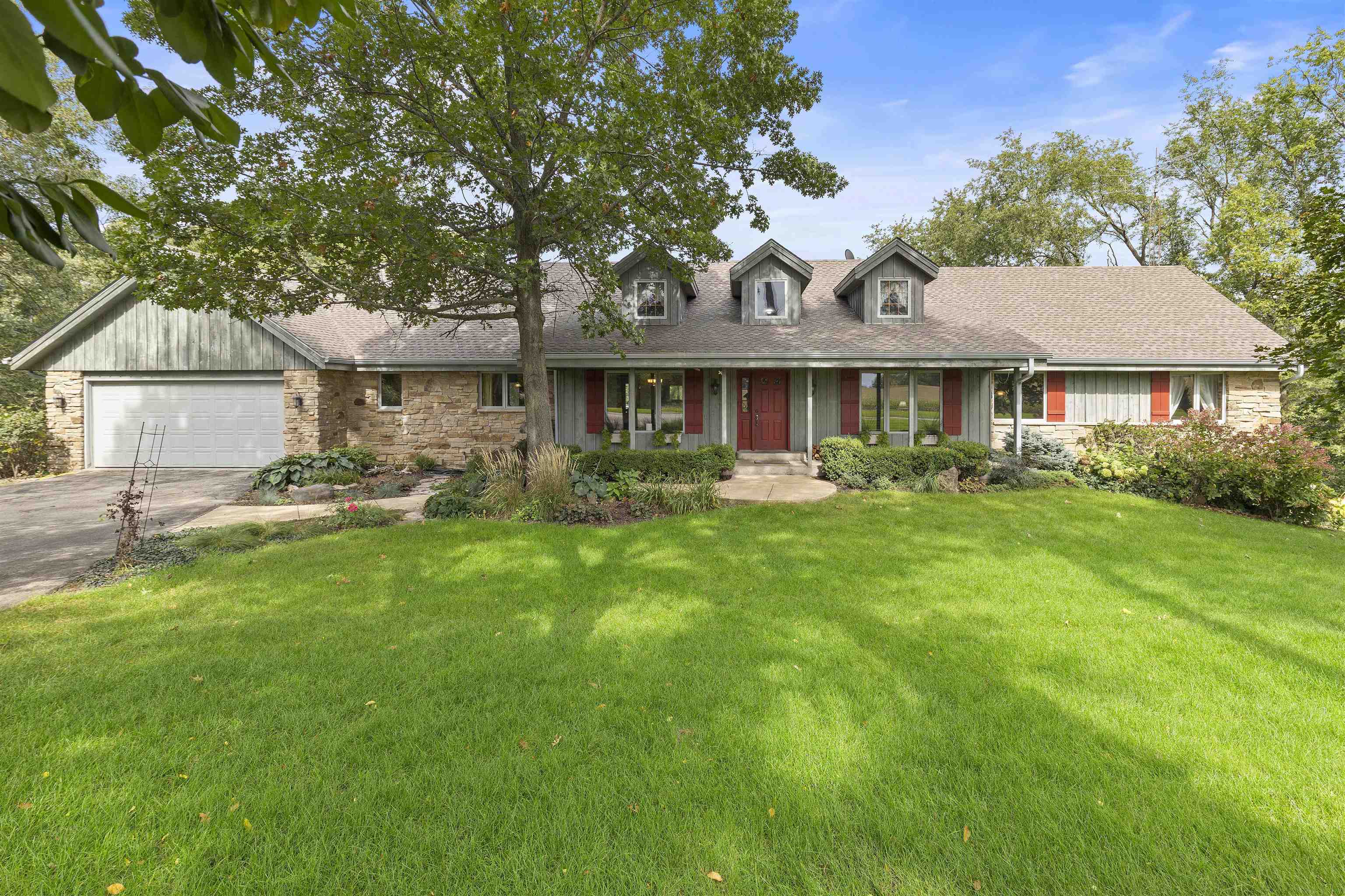 3410 Rotary Road Rockford, IL 61109 - Photo 1 of 65 a front view of a house with garden