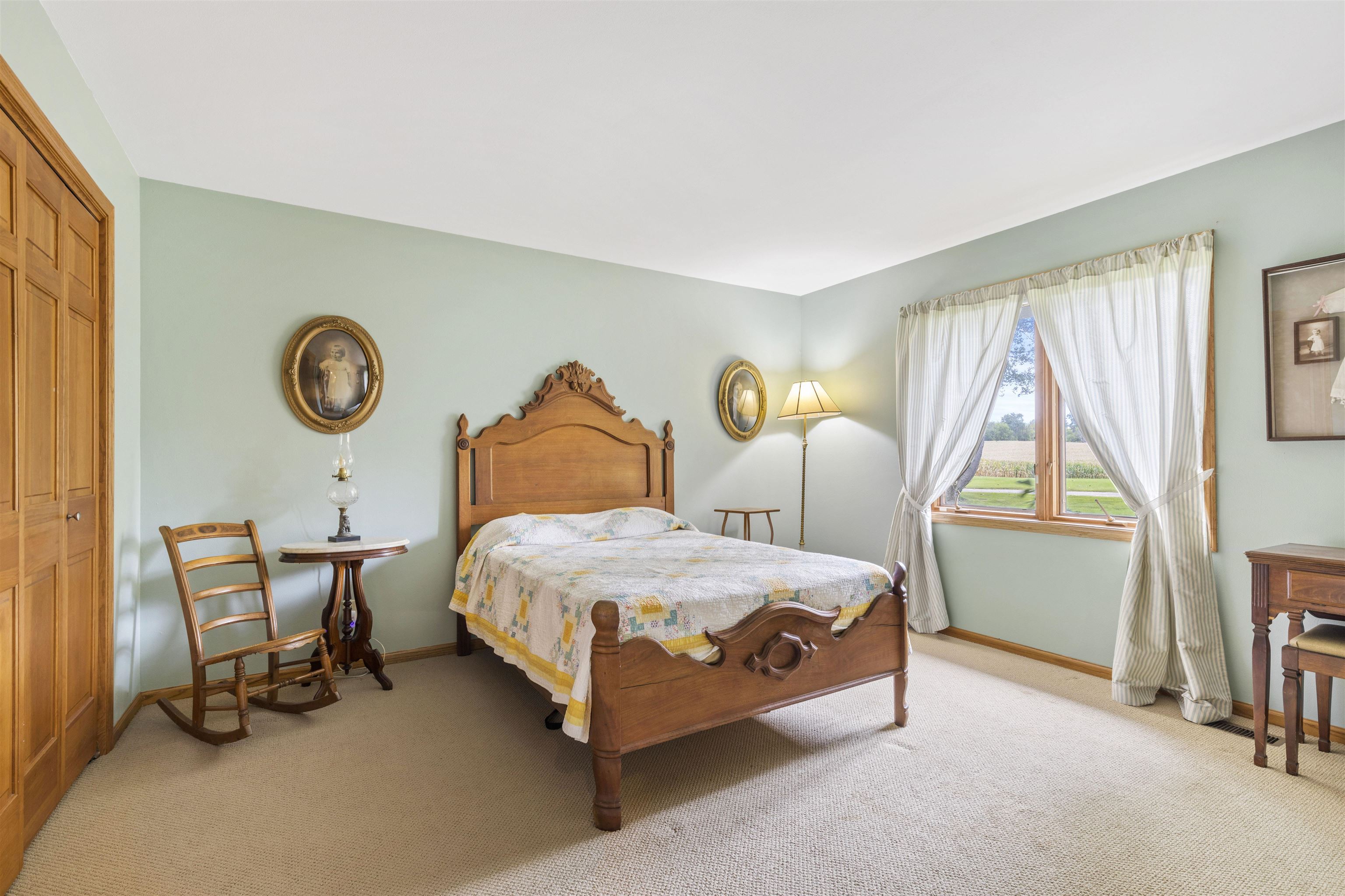 3410 Rotary Road Rockford, IL 61109 - Photo 23 of 65 a bedroom with a bed a chair and a large window